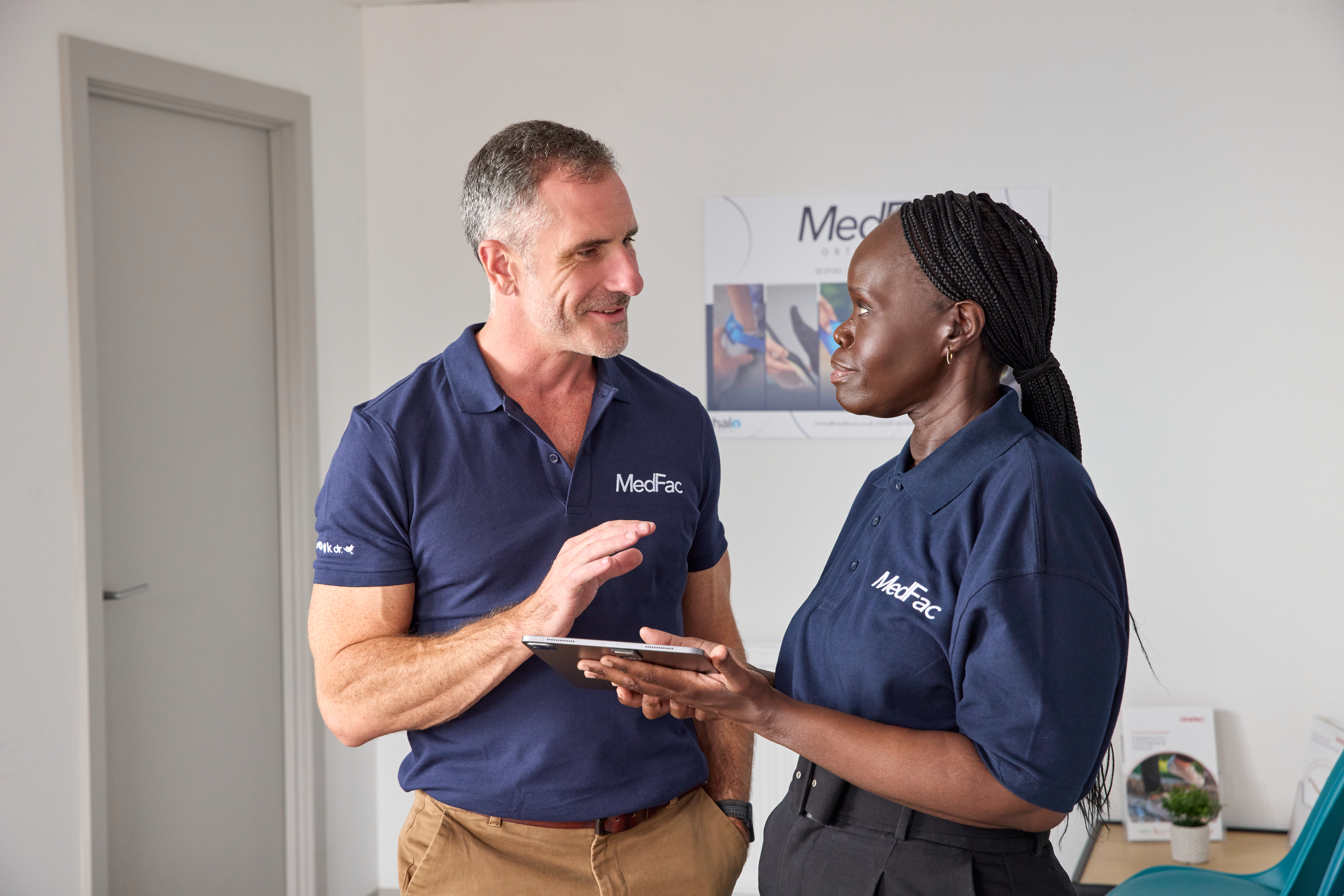 Two MedFac orthotists talking to each other